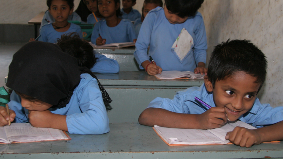 A Child in india smiles in school